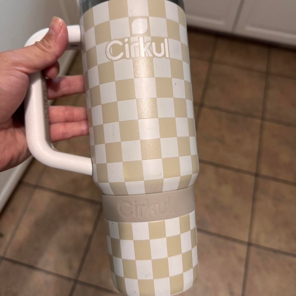 white + tan checkered water bottle